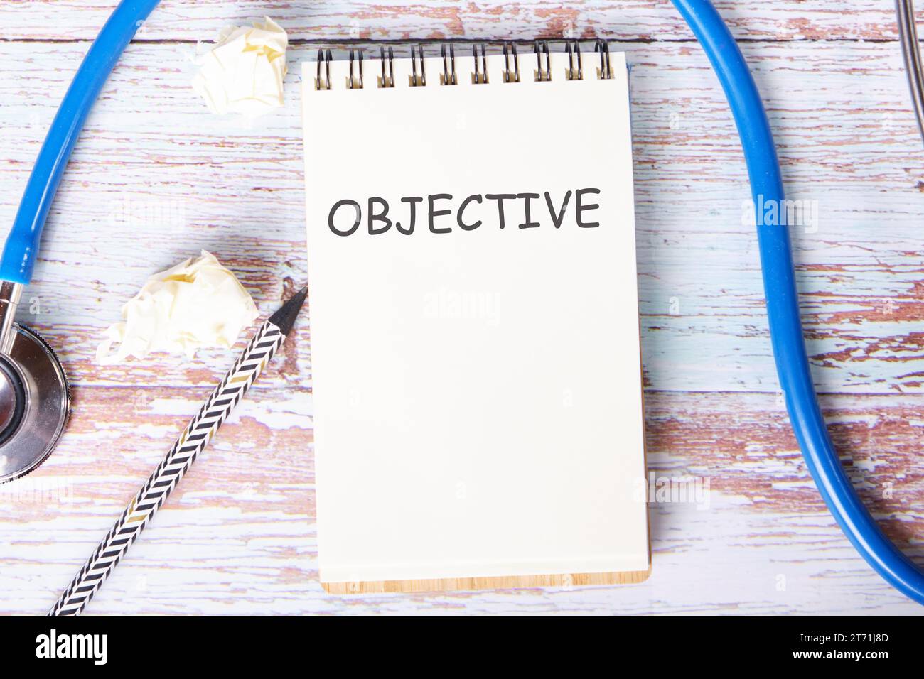 Objective Note Book OBJECTIVE the text is written on a notebook that lies on old vintage ...