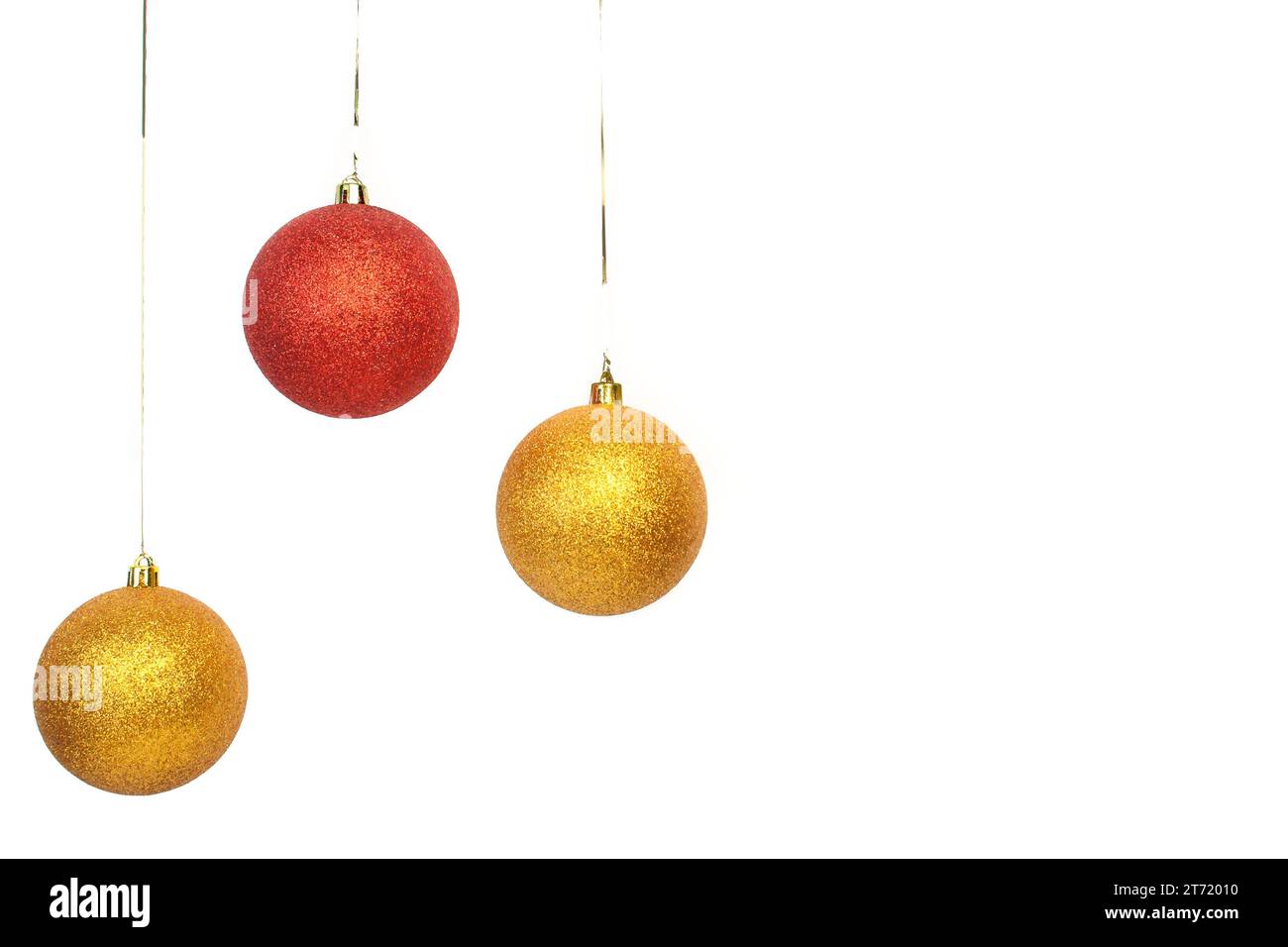 red and gold balls left side on white background; red and gold balls