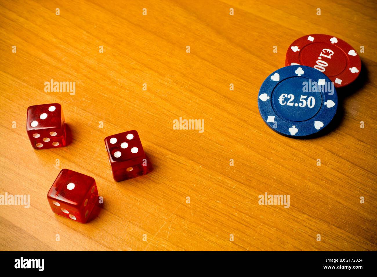 detail of dice and gambling chips on old wood; detail of dice and gambling chips on old wood Stock Photo