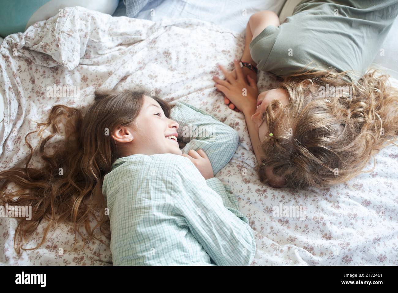 Girls lying on bed hi-res stock photography and images - Alamy