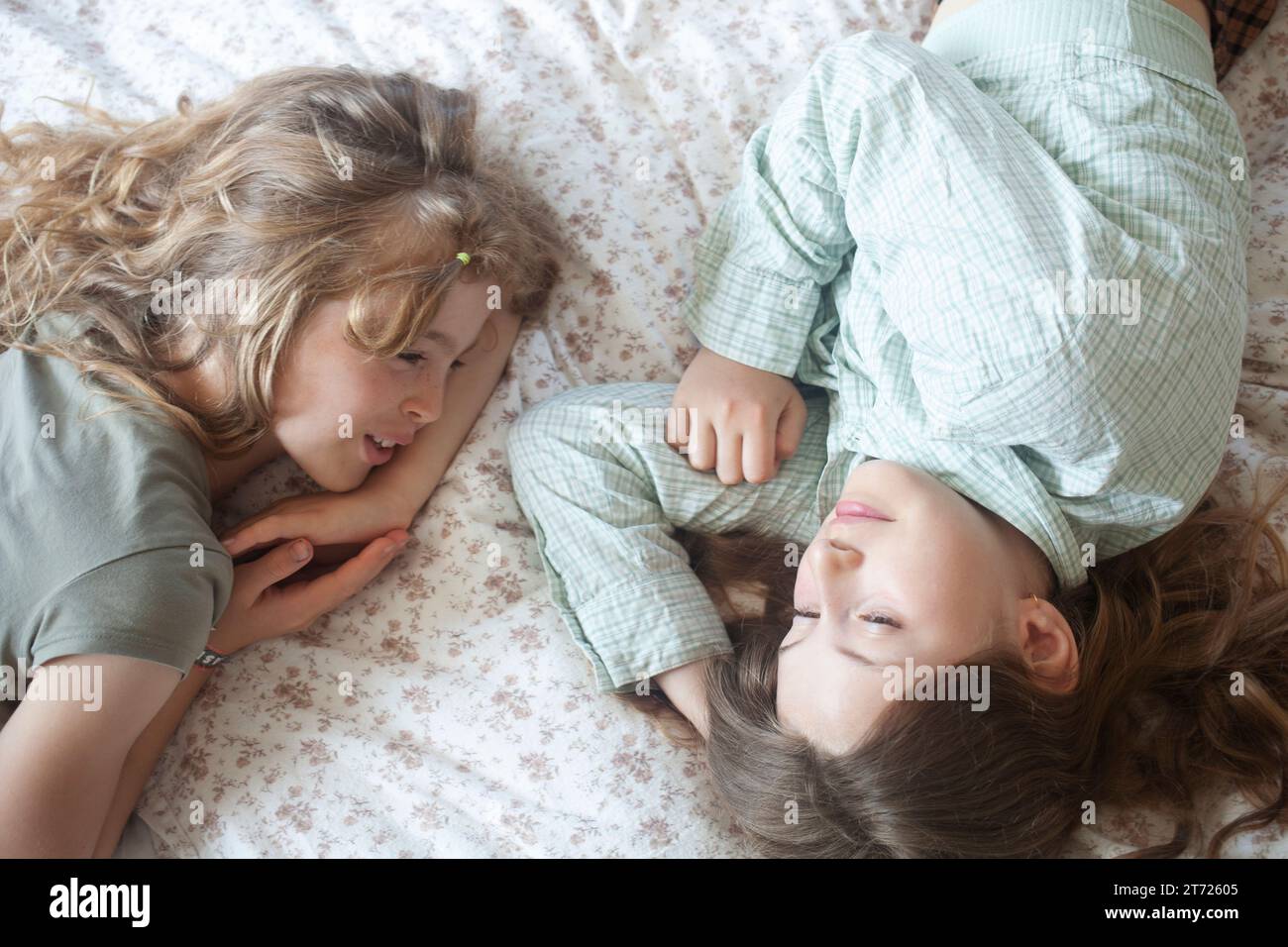 Girls lying on bed hi-res stock photography and images - Alamy