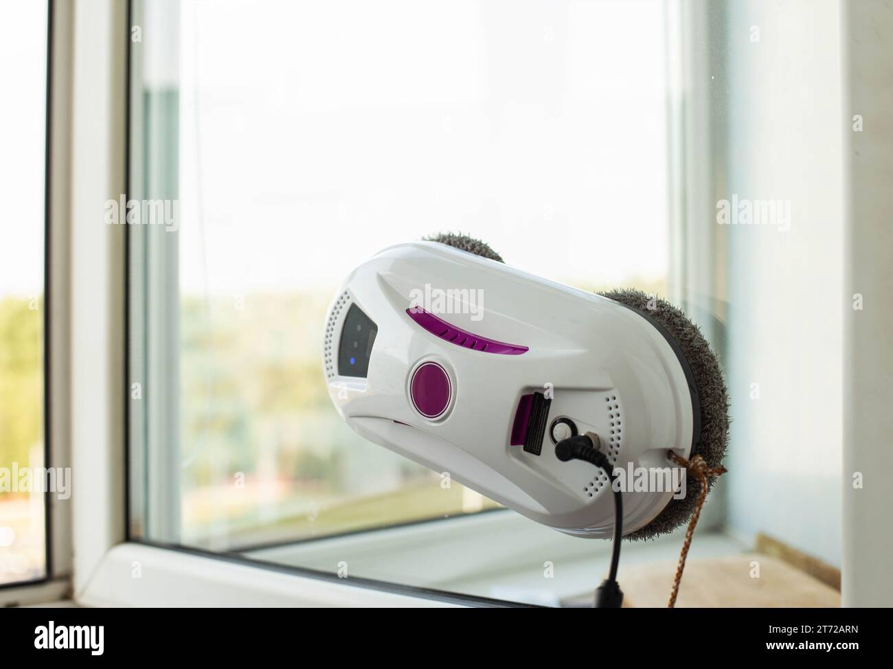 Clean windows safely with a window cleaning robot. Stock Photo