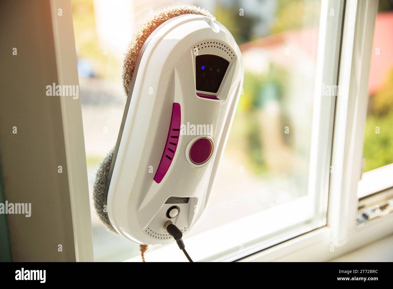 Modern device for cleaning glass from dirt and streaks. Robot washer