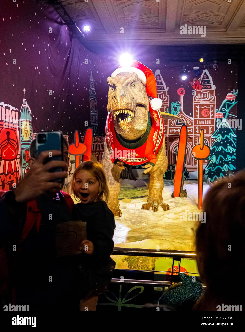 The Natural History Museum's iconic Tyrannosaurus rex in Christmas