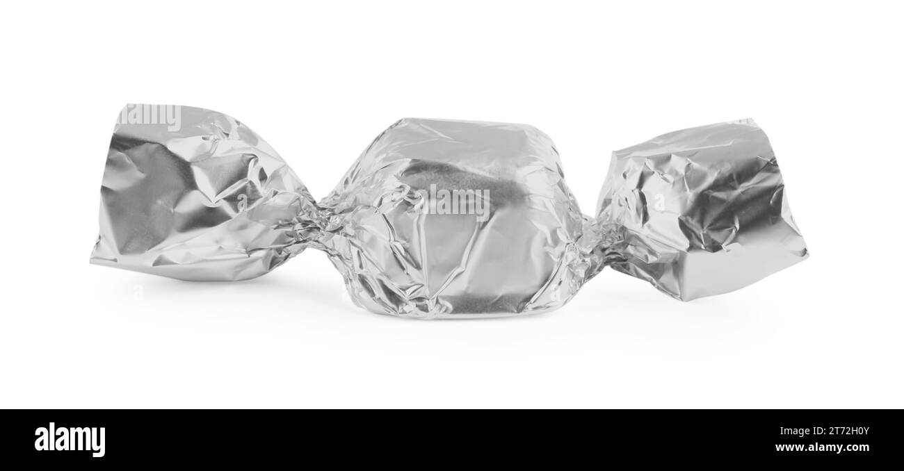 Tasty candy in silver wrapper isolated on white Stock Photo