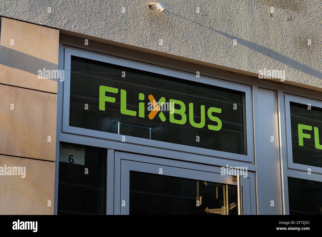 FlixBus logotype on a building of a ticket service. Logo sign of the private transportation