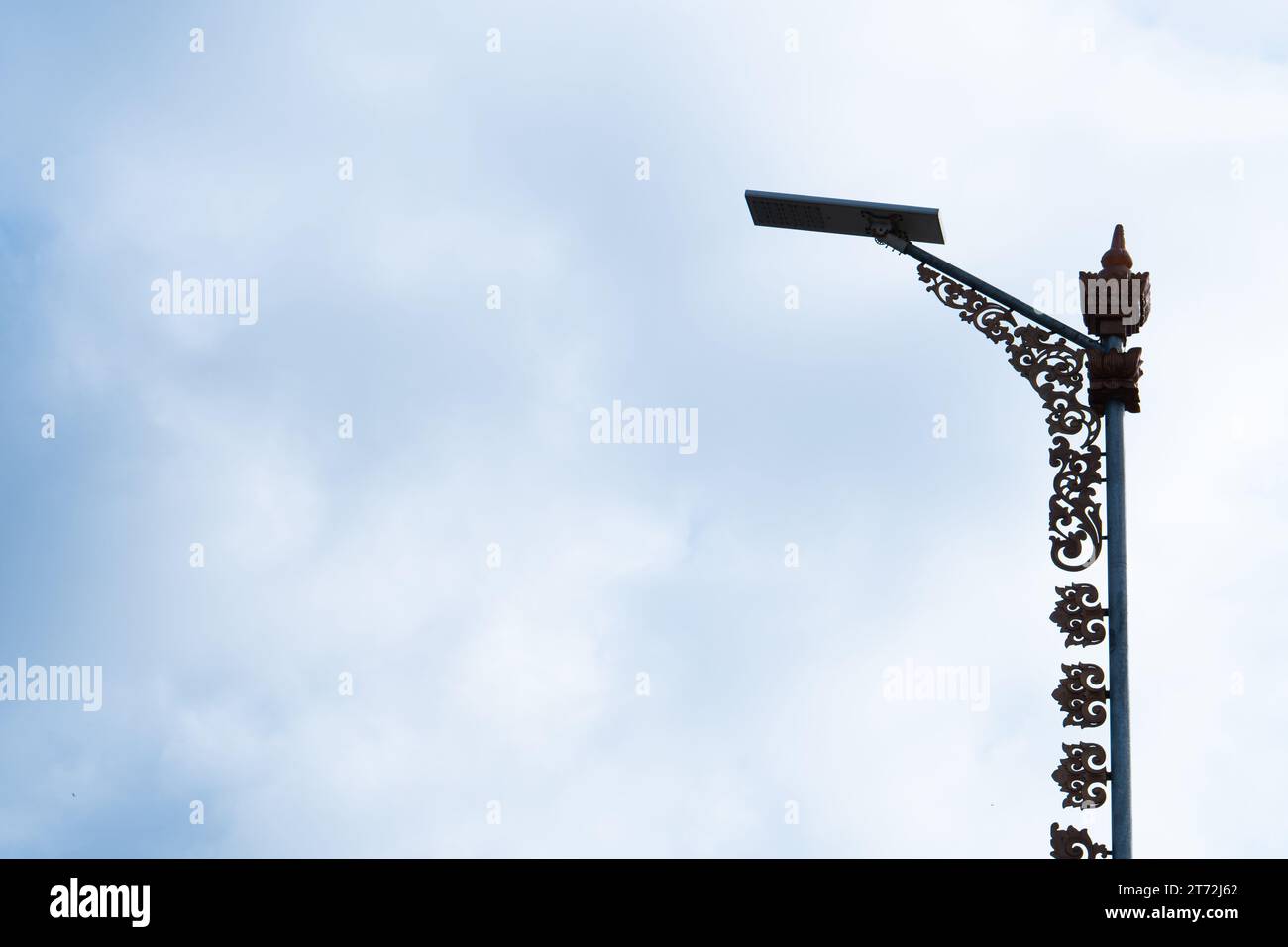 Modern street lamp against the blue sky. Stock Photo