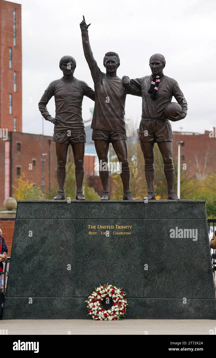 Processional Trafford A wreath next to The United Trinity Statue outside Old Trafford in ...