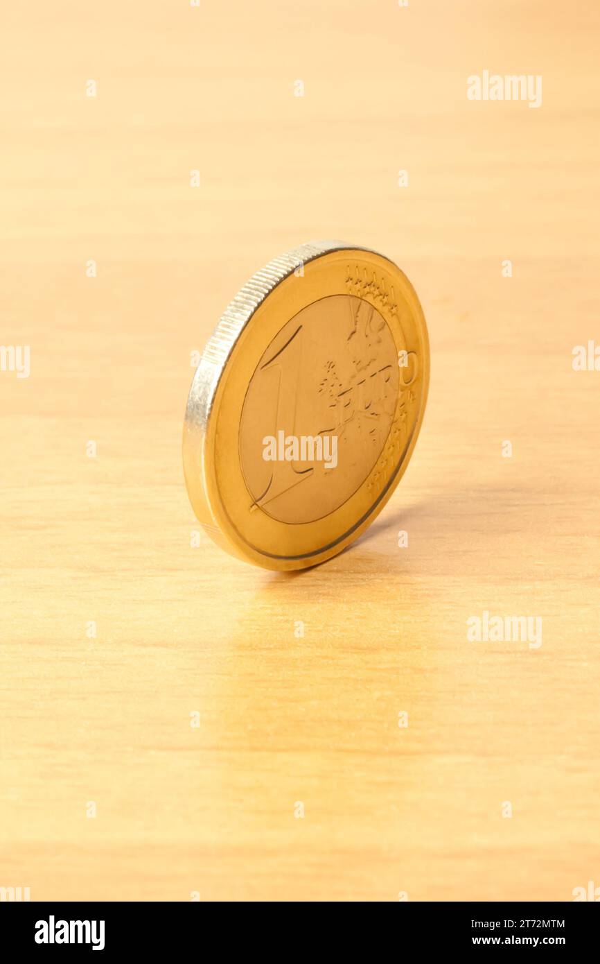 Euro coin on wood hi-res stock photography and images - Alamy