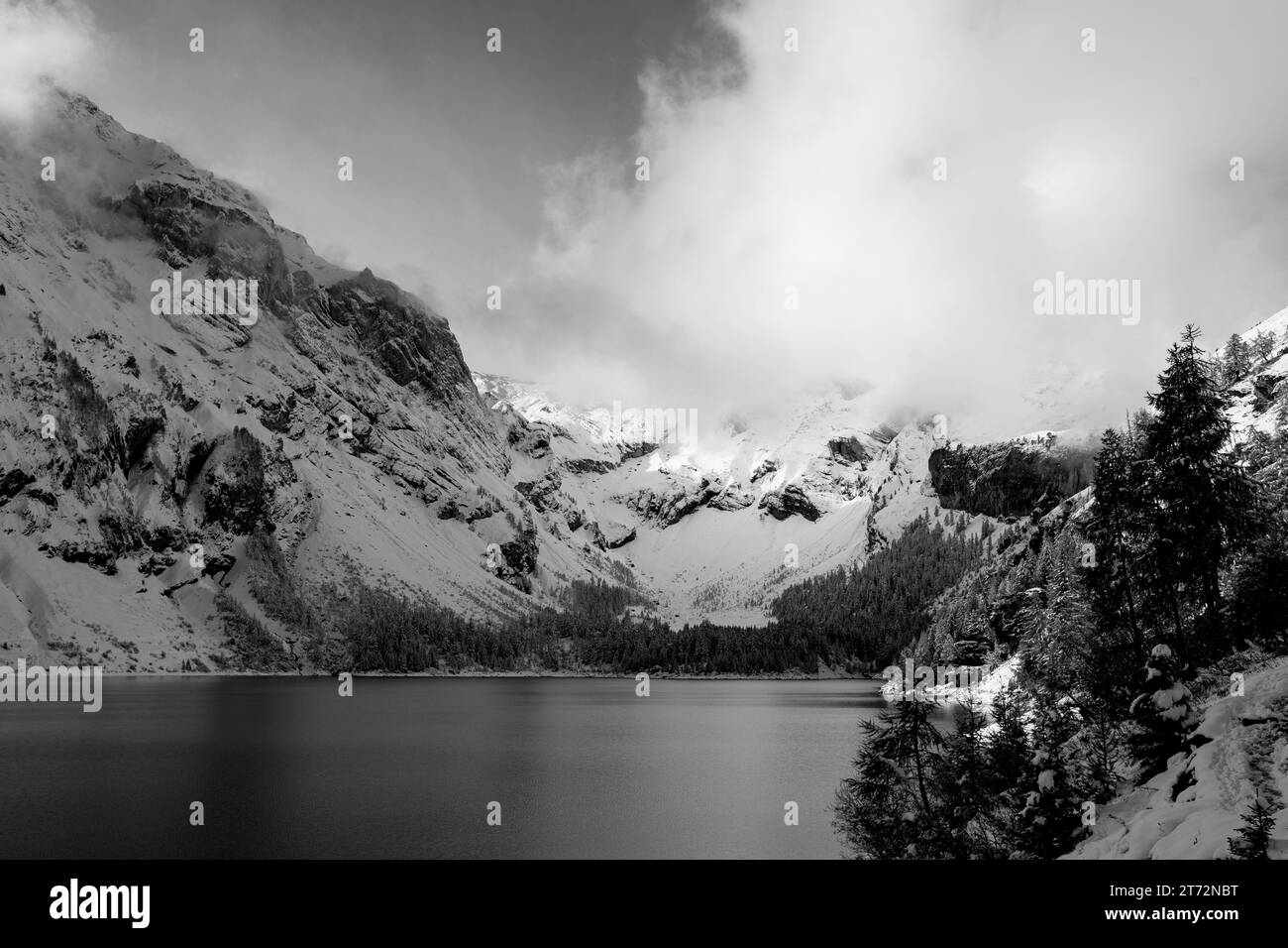 Snowy mountains and their lake in black and white Stock Photo - Alamy