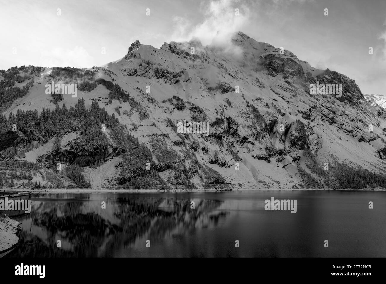 Snowy mountains and their lake in black and white Stock Photo - Alamy