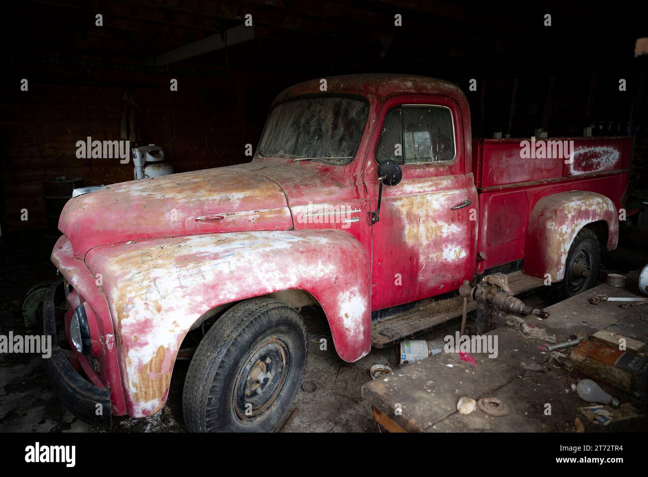 Old International Pickup in a garage in North Dakota Stock Photo