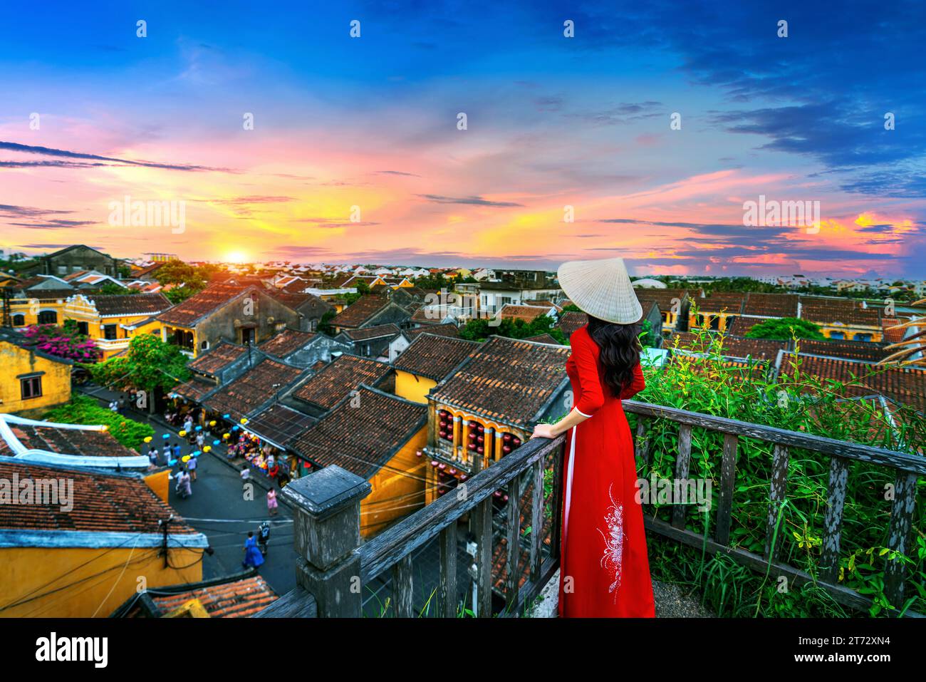 Tourist enjoying sunset on rooftop at Hoi an ancient town, Vietnam. Stock Photo