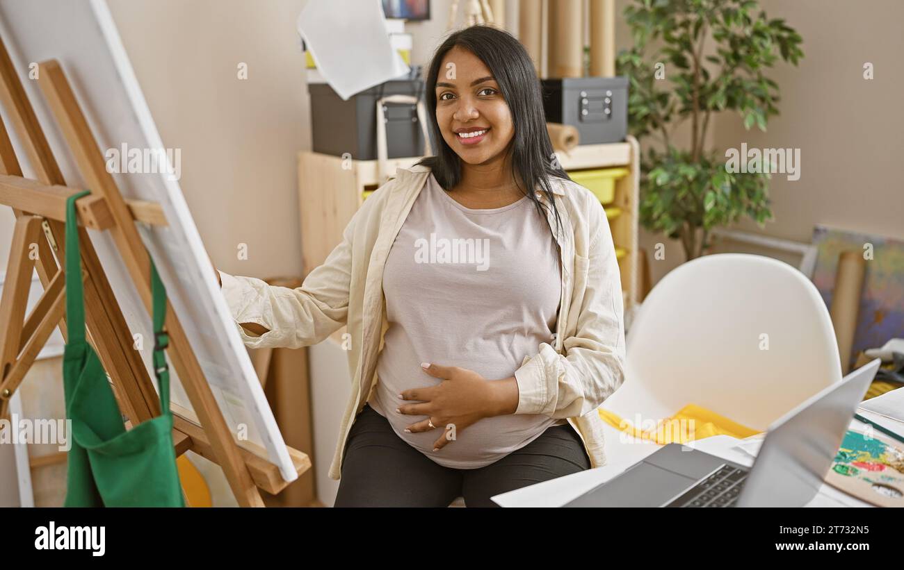 Happy beautiful pregnant woman, expectant mother choosing canvas and  painting tools in art shop, experiencing happy moments of her pregnancy and  mater Stock Photo - Alamy