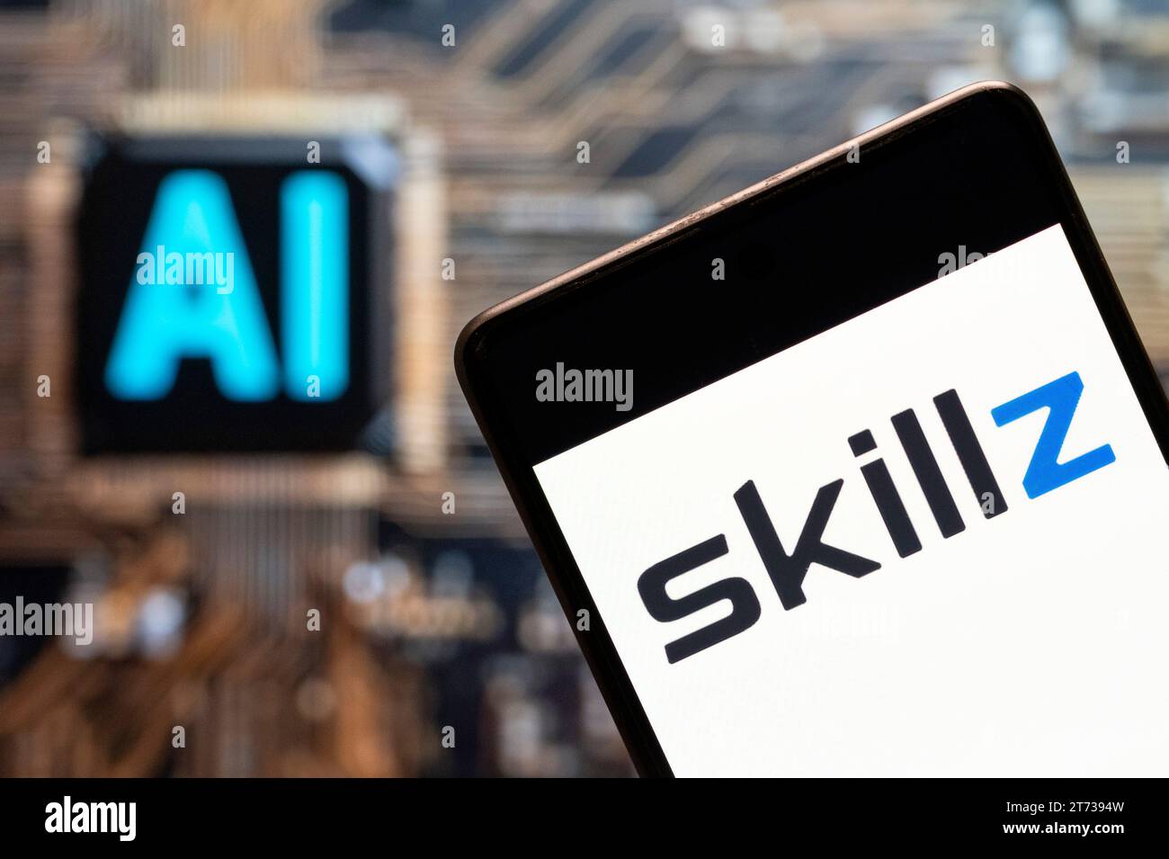 China. 3rd Nov, 2023. In this photo illustration, the online mobile multiplayer gaming competition platform Skillz (NYSE: SKLZ) logo seen displayed on a smartphone with an Artificial intelligence (AI) chip and symbol in the background. (Credit Image: © Budrul Chukrut/SOPA Images via ZUMA Press Wire) EDITORIAL USAGE ONLY! Not for Commercial USAGE! Stock Photo