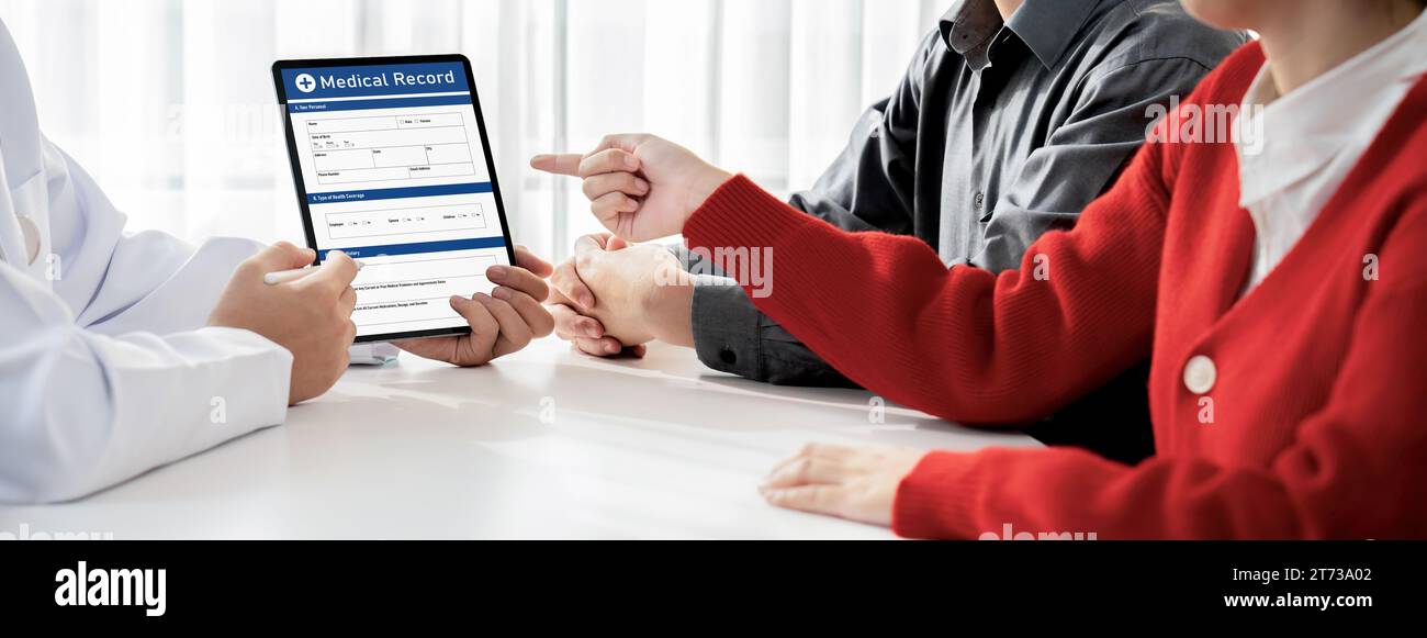 Couple attend fertility consultation with gynecologist at hospital as part family planning care