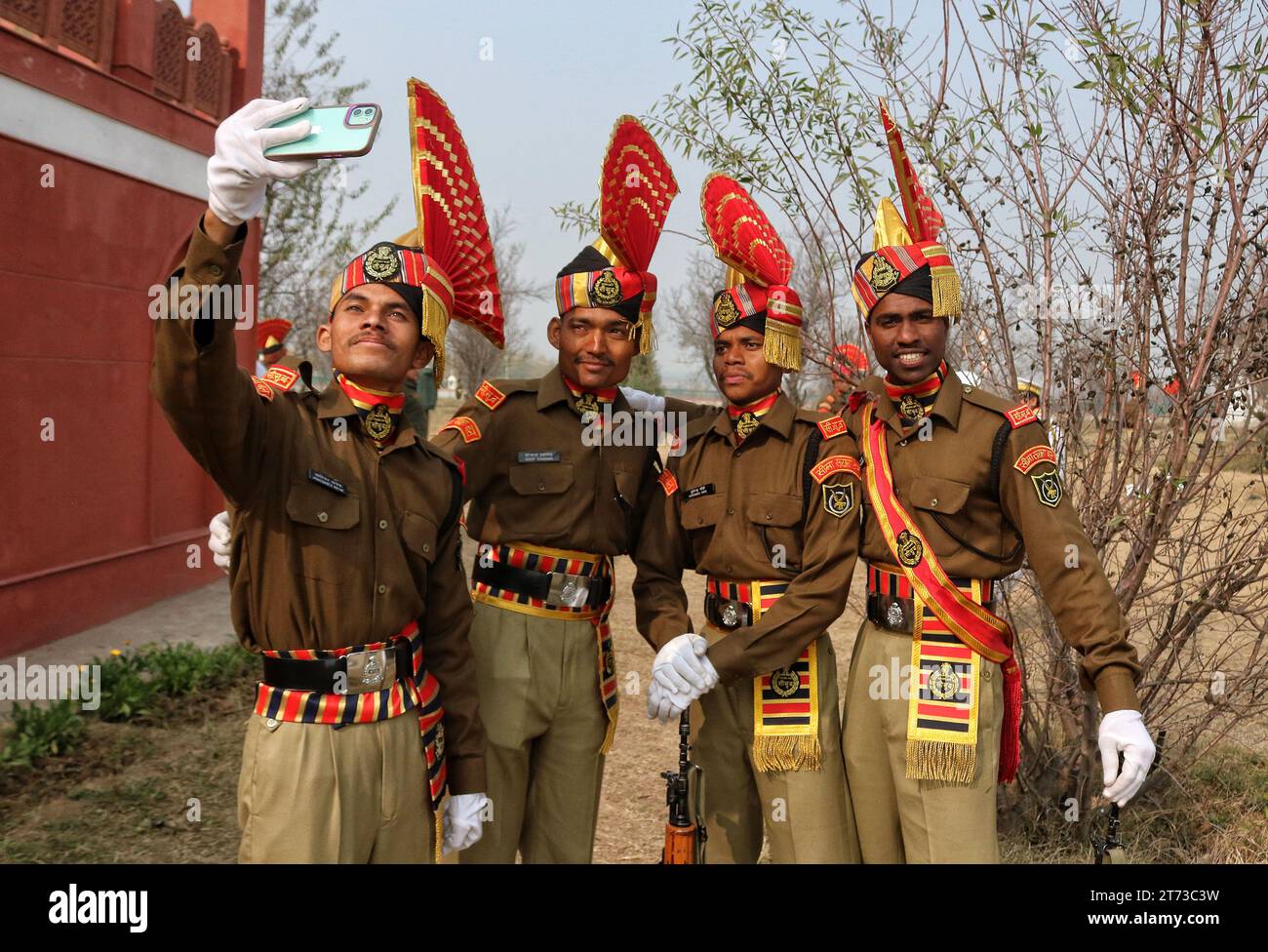 November 09, 2023, Srinagar Kashmir, India : New recruits of the Indian Border Security Force (BSF) take selfie pictures after participating in the passing out parade in Humhama, on the outskirts of Srinagar. A total of 599 recruits were formally inducted into the BSF, an Indian paramilitary force, after completing 44 weeks of training in physical fitness, weapon handling, commando operations and counter insurgency, a BSF spokesman said. On November 09, 2023, Srinagar Kashmir, India. (Photo By Firdous Nazir/Eyepix Group/Sipa USA) Stock Photo