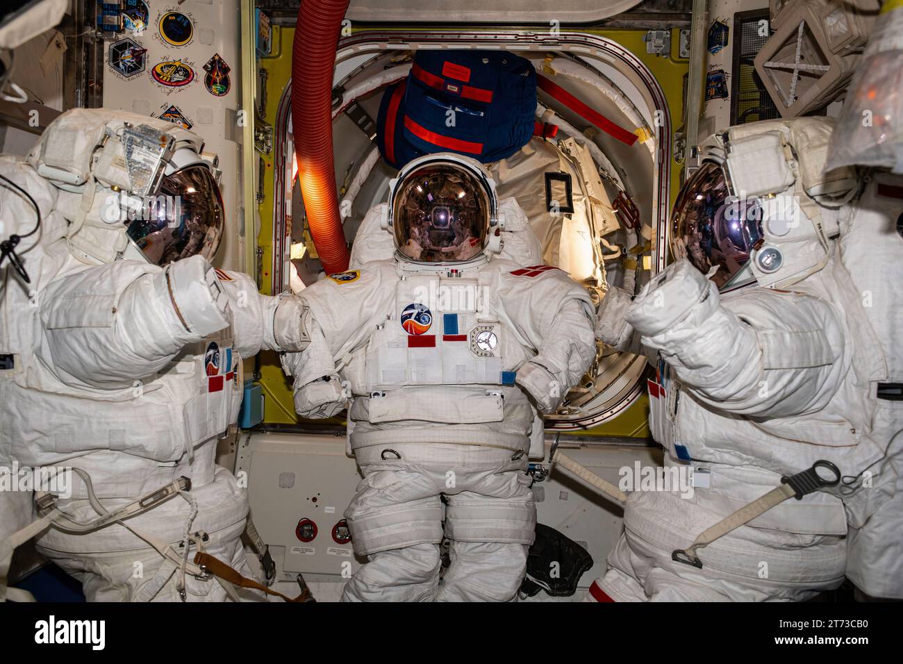 ISS - 07 November 2023 - Three near-assembled spacesuits, with their gloves unattached, are pictured inside the International Space Station's Quest ai Stock Photo