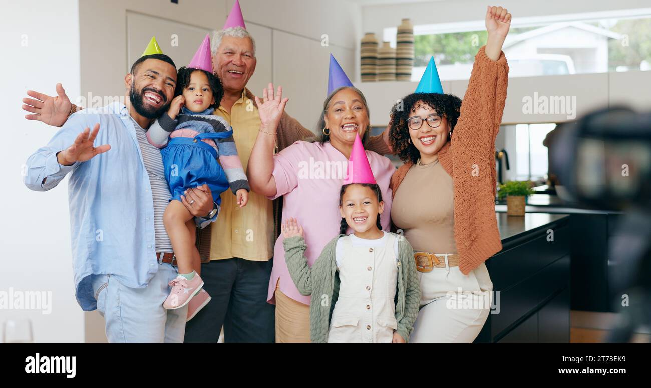 Happy family, birthday hats and photography for party, children and parents. House, grandparents and celebration with timer, excited and cheers with Stock Photo