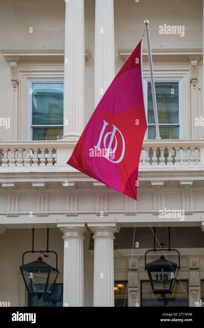 Corporate flag flying above the main entrance to the Institute of Directors, a members