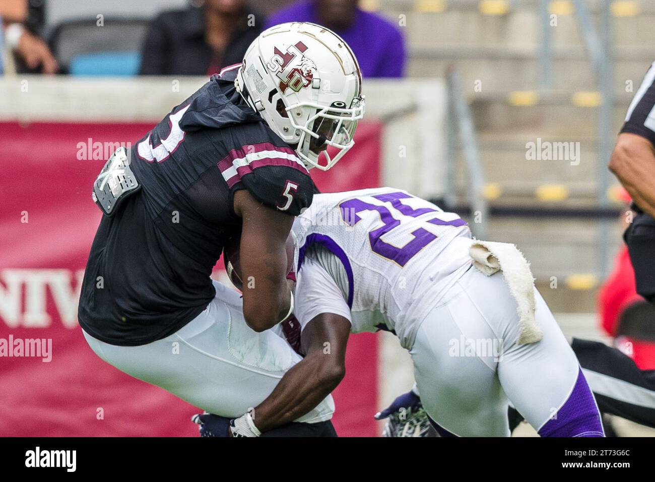 Houston, Texas, USA. 12th Nov, 2023. Texas Southern Tigers wide receiver Quay Davis (5) is tackled by Alcorn State Braves defensive back Robert McDaniel (29) during the NCAA football game between the Alcorn State Braves and the Texas Southern Tigers at Shell Energy Stadium in Houston, Texas. Texas Southern defeated Alcorn State 44-10. Prentice C. James via Cal Sport Media/Alamy Live News Stock Photo