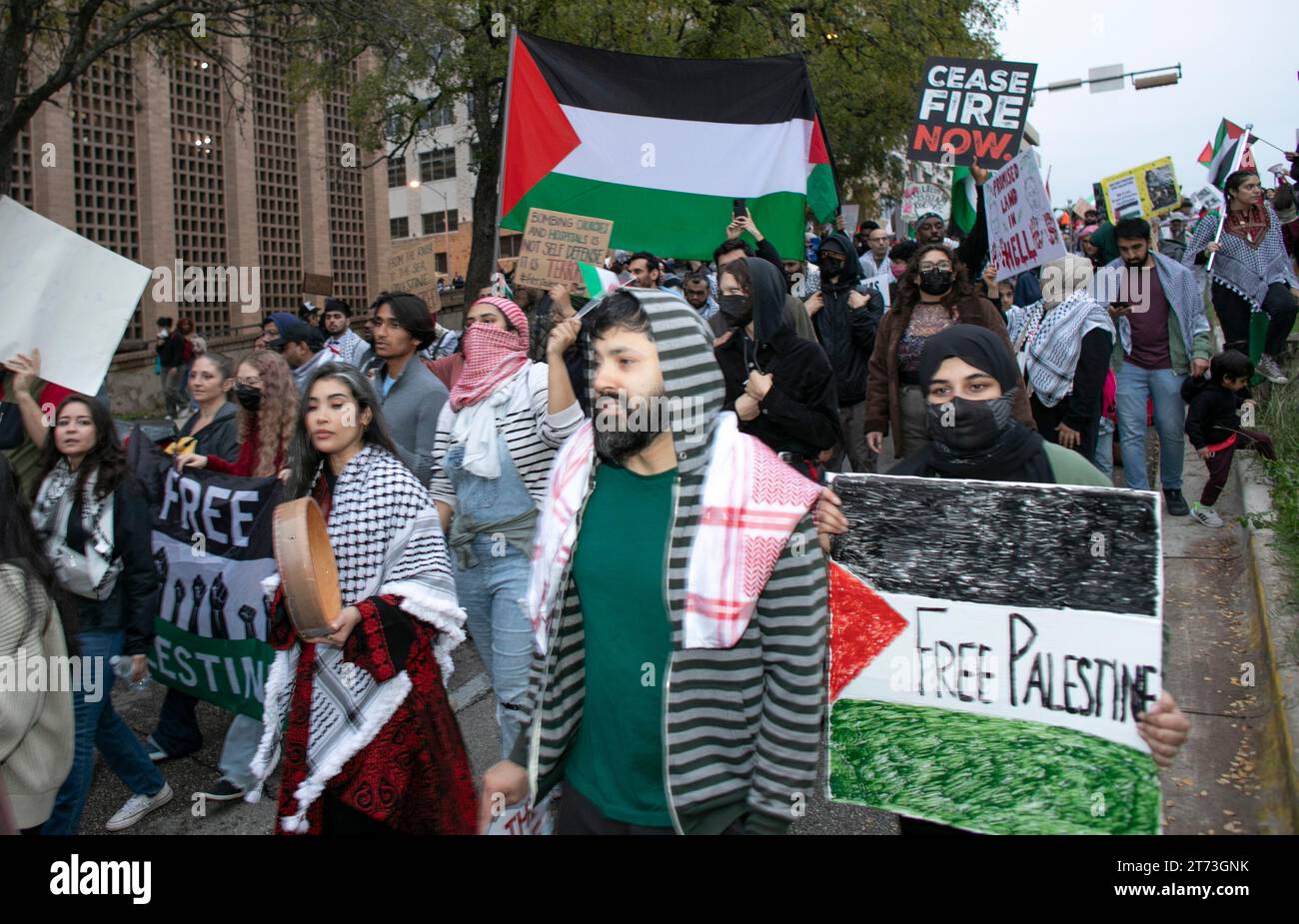 Austin, Texas, USA, November 12, 2023: An estimated 7,000 protesters, many carrying handmade protest signs advocating for Middle East peace, fill downtown streets near the Texas Capitol. The pro-Palestine marchers decried the killing of innocent civilians and children while calling on USA lawmakers to insist on a cease-fire. Credit: Bob Daemmrich/Alamy Live News Stock Photo