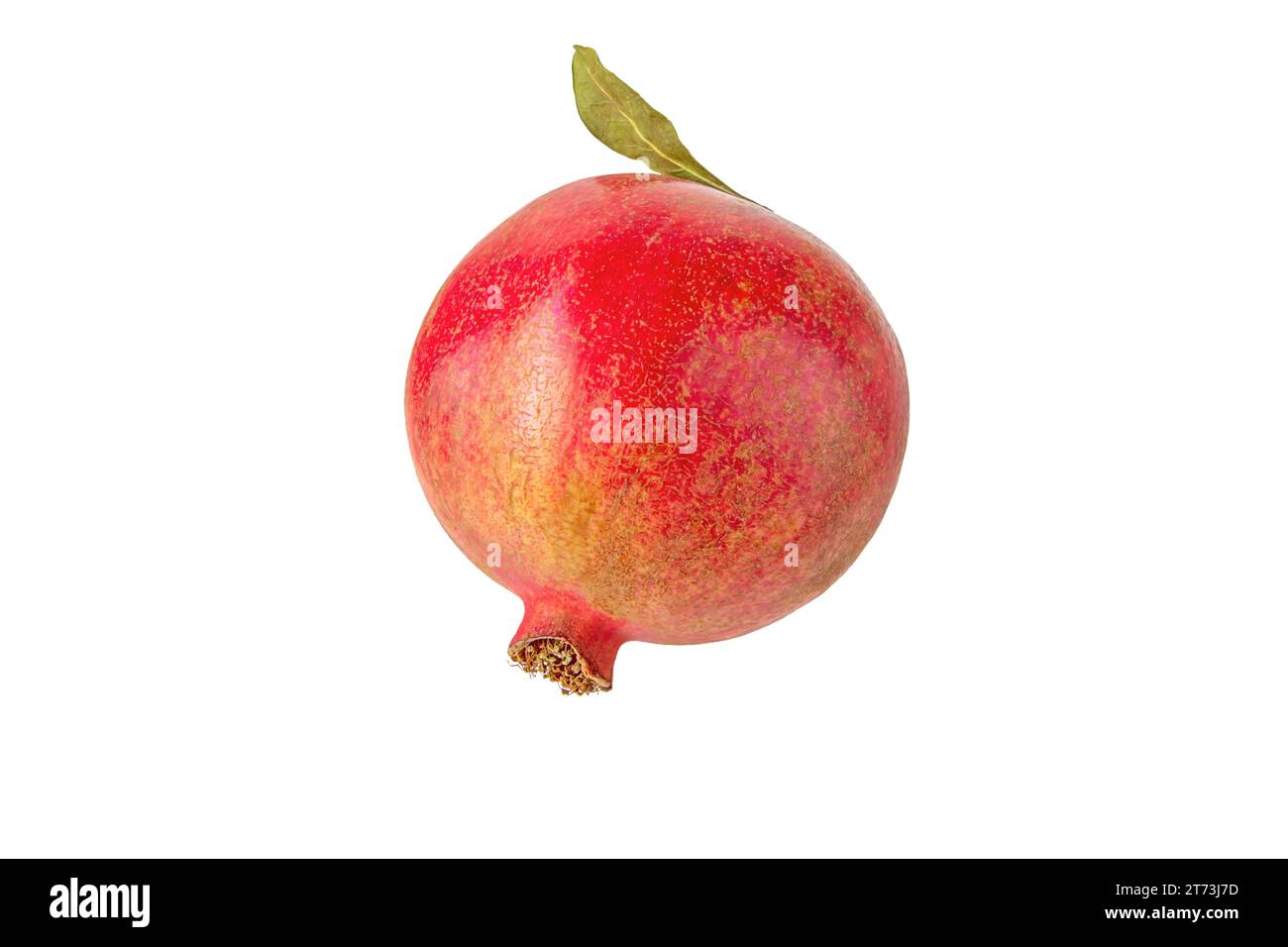Red ripe pomegranate fruit with green leaf isolated on white. Punica granatum. Stock Photo