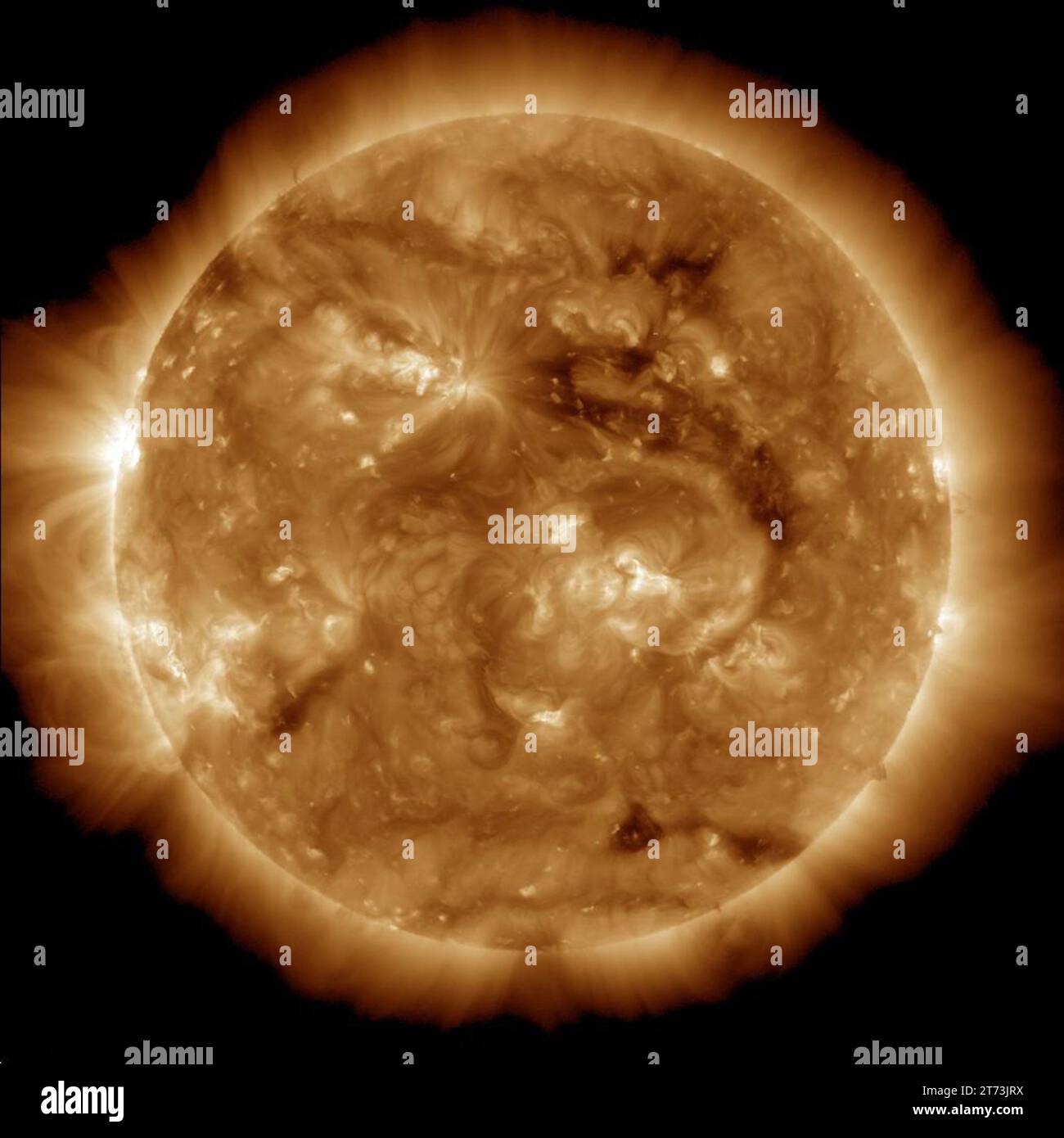 The dark region seen on the face of the sun at the end of March 2013 is a coronal hole (just above and to the right of the middle of the picture), whi Stock Photo