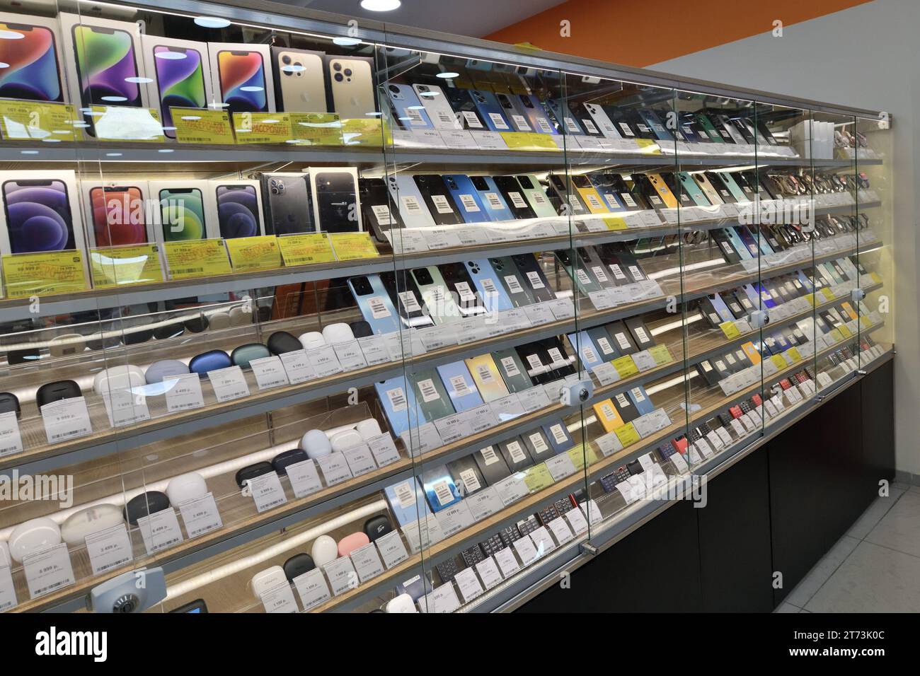 Moscow, Russia Nov 11. 2023. Cell phones and wireless headphones in