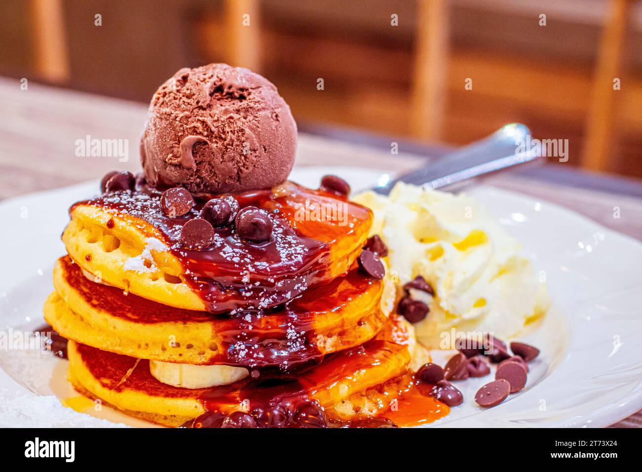 Decadent Delights: Indulging in Chocolate-Kahlua Pancakes with Espresso Mascarpone and Premium Chocolate Ice Cream Stock Photo