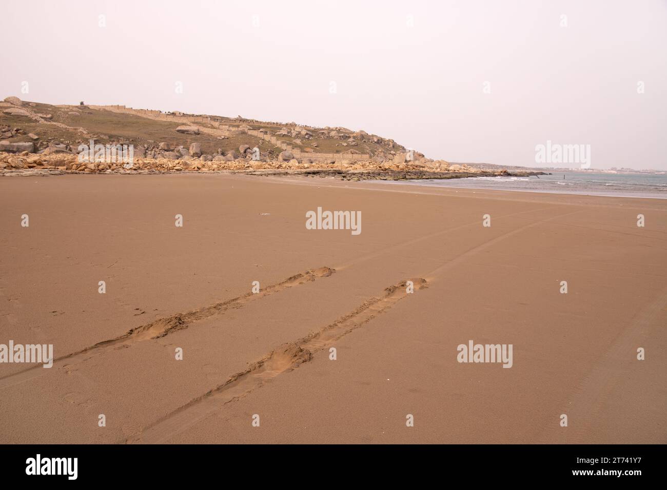 Traces from the car on the shore of the Caspian Sea. Stock Photo