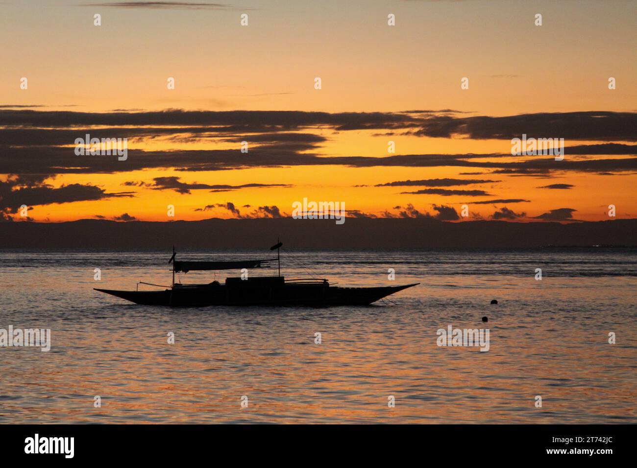 Sunset over boat on sea hi-res stock photography and images - Alamy