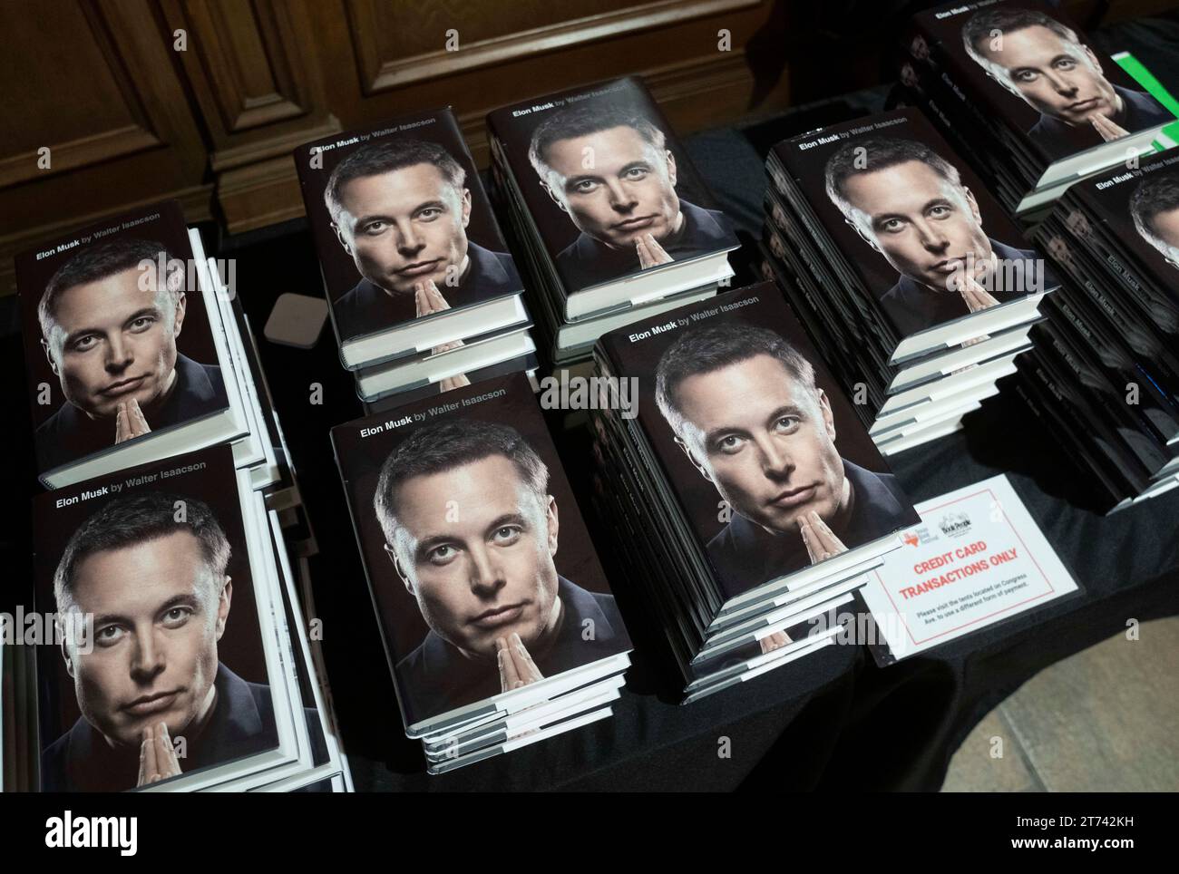 Austin Texas USA, November 11 2023: Copies of Walter Isaacson's biography of Elon Musk sit on a table as the author (not shown) discusses his latest book about the eccentric entrepreneur at the Texas Book Festival. ©Bob Daemmrich Stock Photo