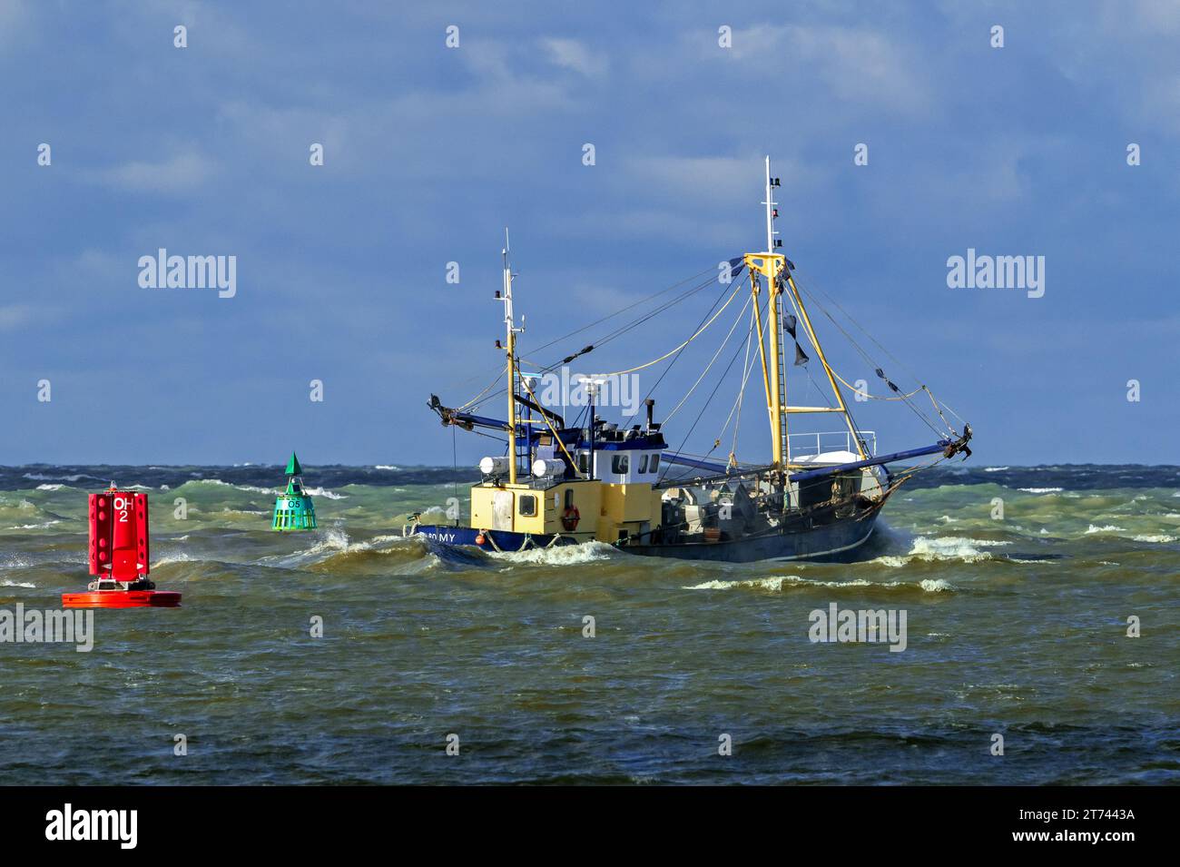 Shrimp cutter 0.191 Romy leaving the Ostend port to go bottom trawling for shrimps along the North Sea coast on a stormy day, Belgium Stock Photo