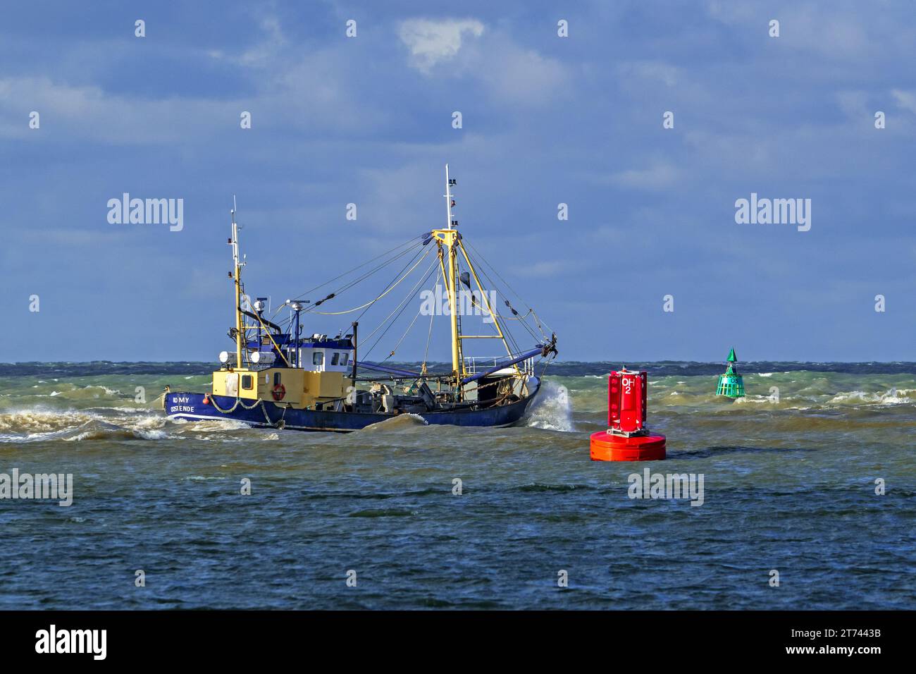 Shrimp cutter 0.191 Romy leaving the Ostend port to go bottom trawling for shrimps along the North Sea coast on a stormy day, Belgium Stock Photo