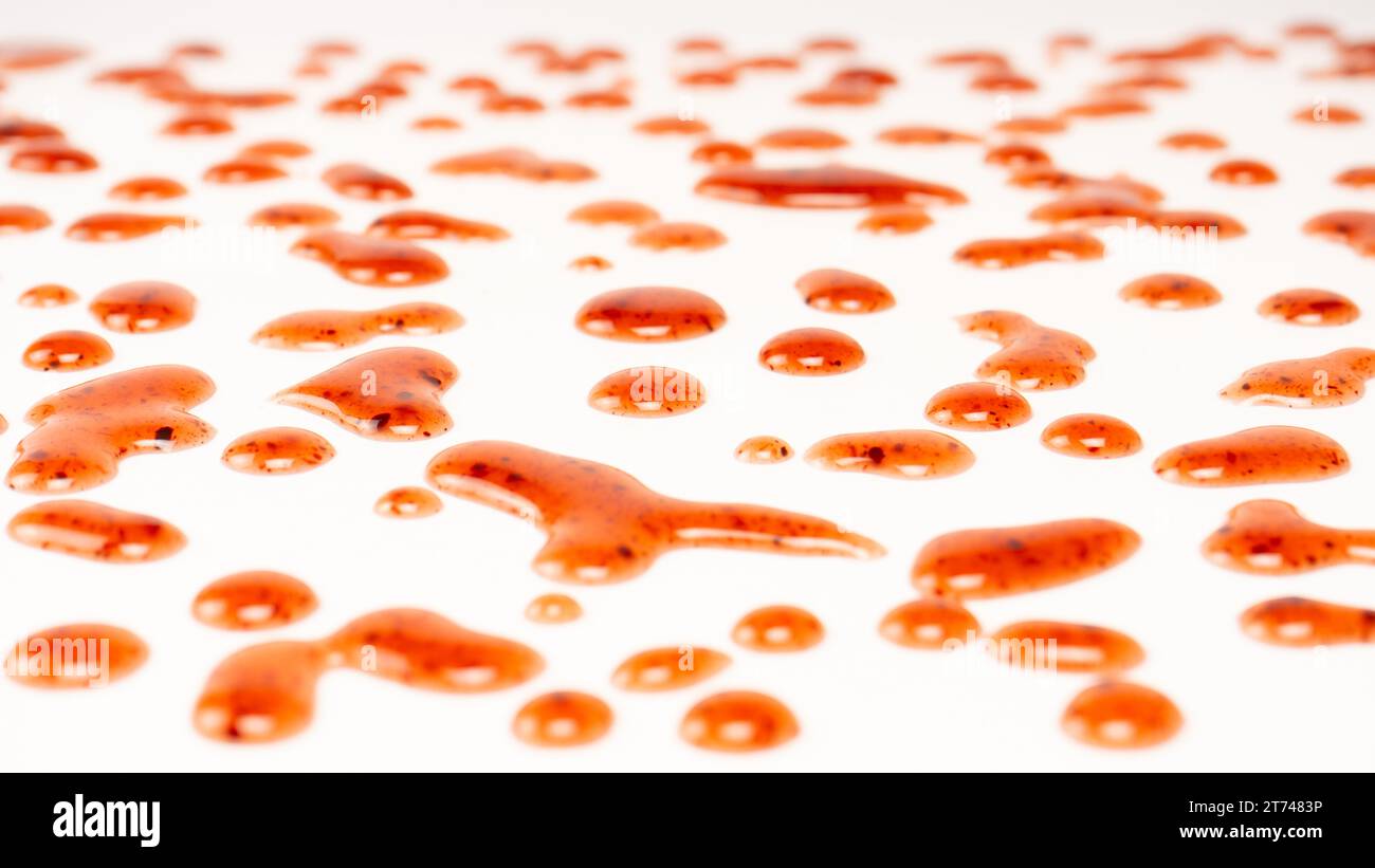 Red jam splashes isolated on a white background. Top view. Stock Photo