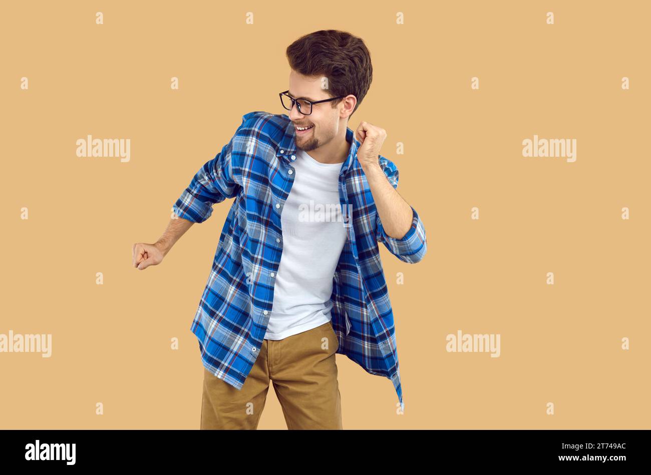 Happy young man dancing over isolated studio background Stock Photo