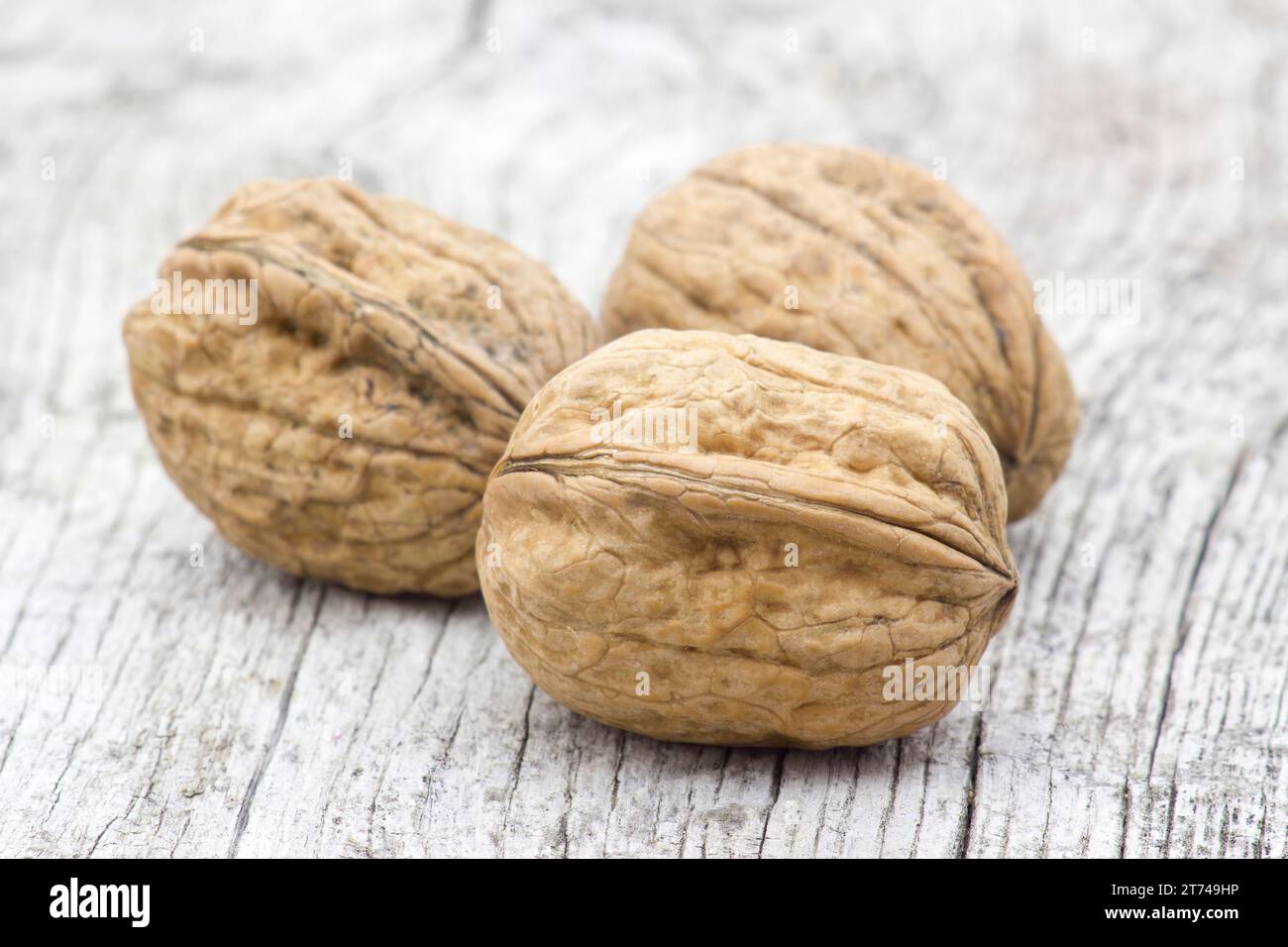 walnuts on wooden background - close up Stock Photo