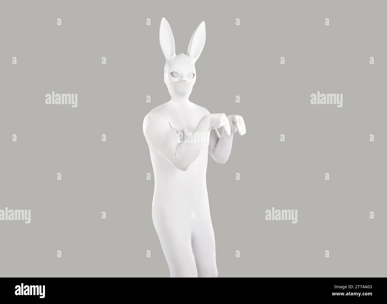 Grey Rabbit Man Funny man in a white bodysuit and rabbit mask jumping like a rabbit on ...