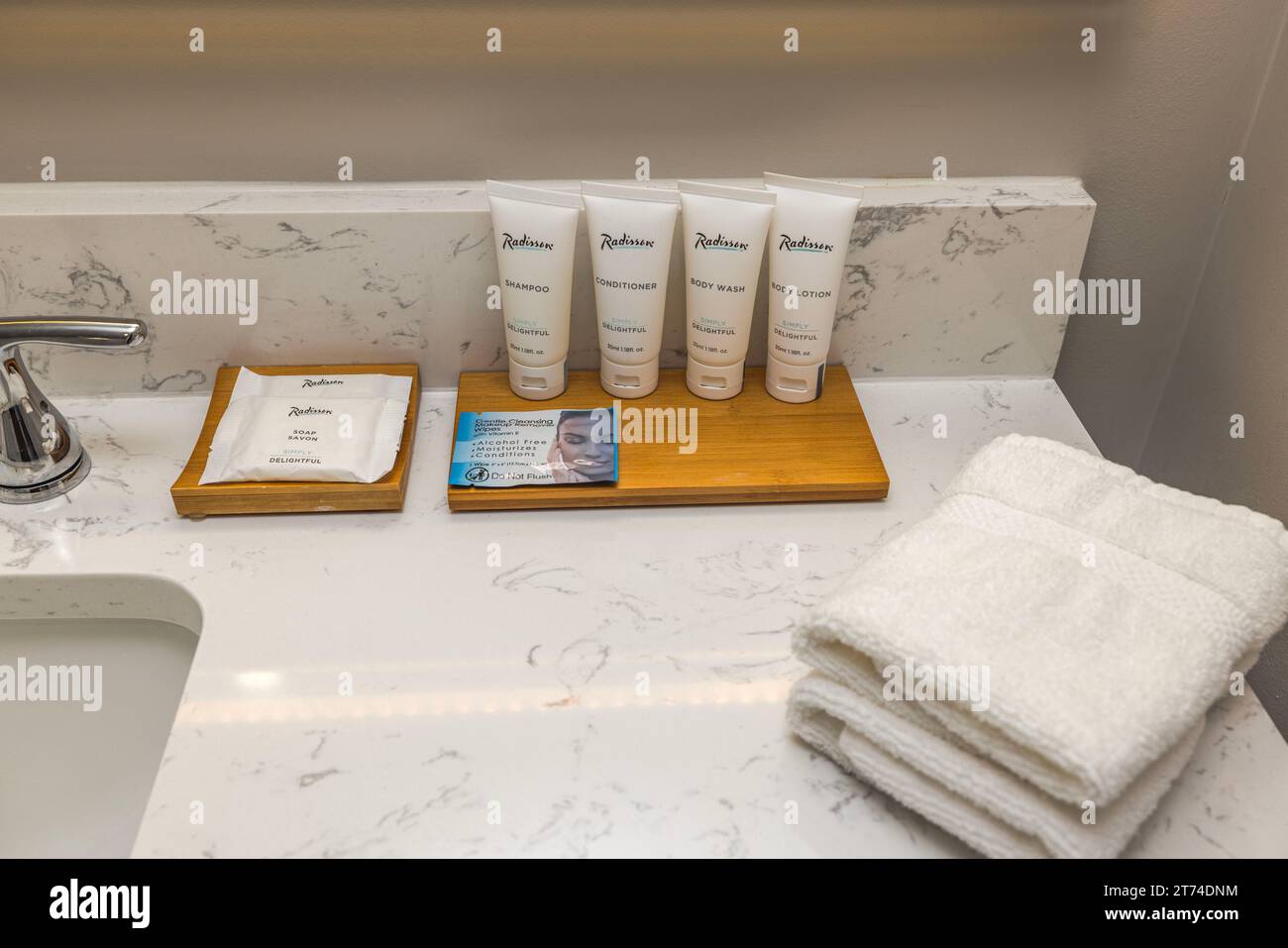 Interior view hotel bathroom. Towels and bathroom essentials for