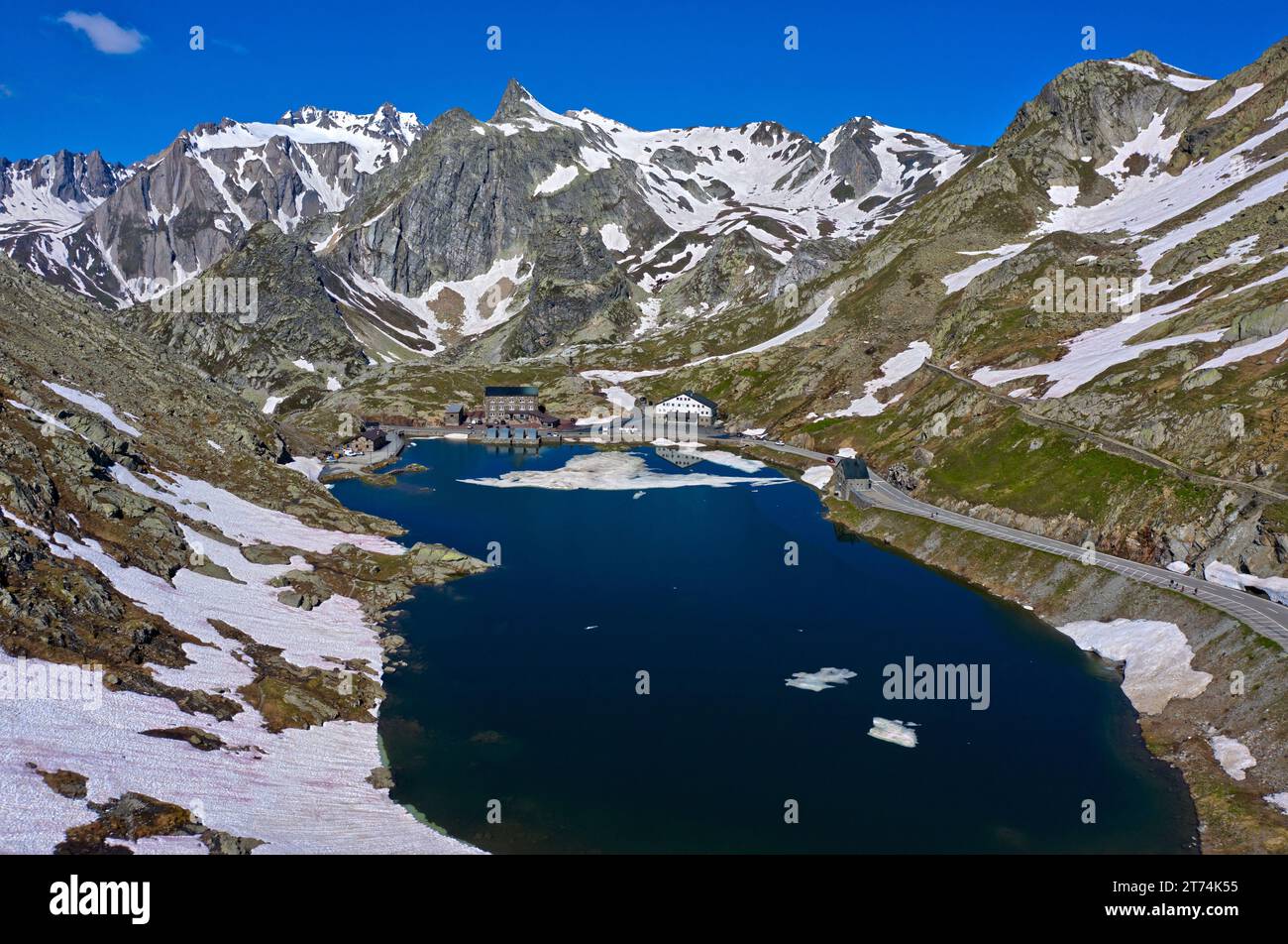 Melting snow on the Lac du Grand-St-Bernard mountain lake on the Great St. Bernard Pass, Bourg-Saint-Bernard, Valais, Switzerland Stock Photo