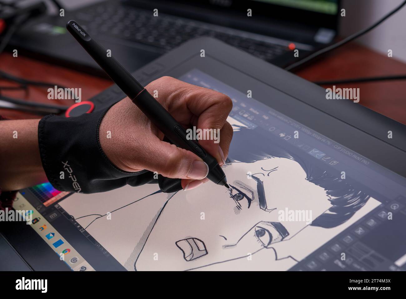 An artist's hand drawing a manga on her digital tablet from home. SMCV