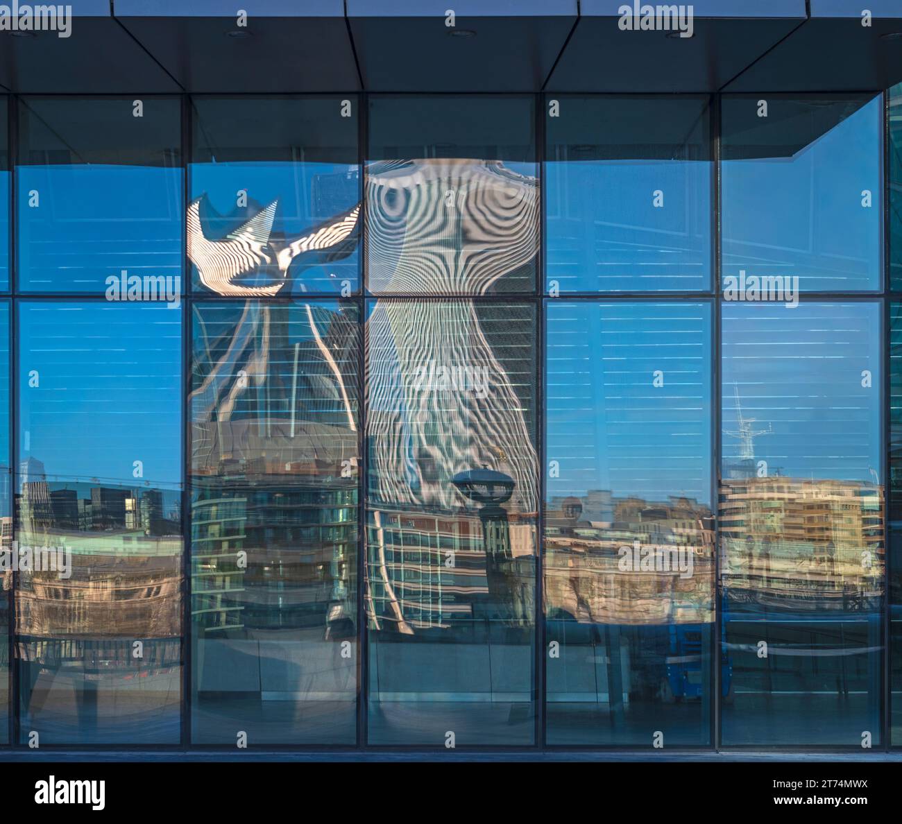 The distorted reflection of The Walkie Talkie building in an office ...