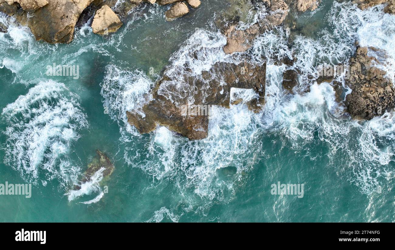 Aerial video beach rocks sea hi-res stock photography and images - Alamy