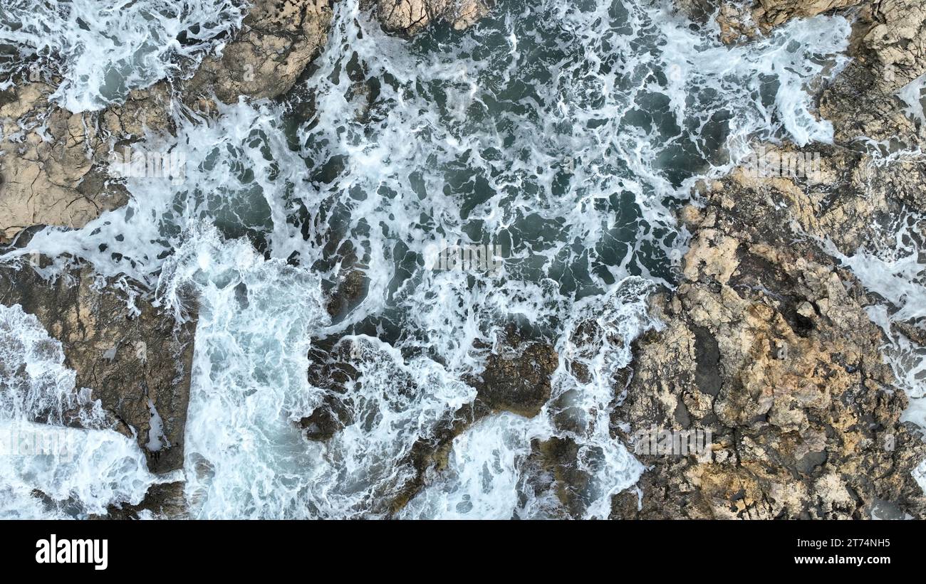Aerial video beach rocks sea hi-res stock photography and images - Alamy