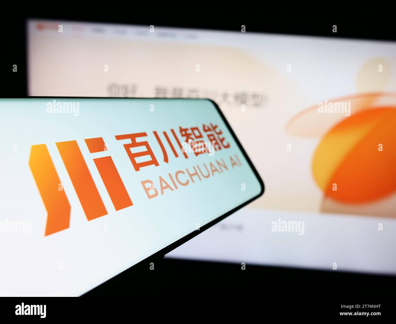 Cellphone with logo of Chinese artificial intelligence company Baichuan AI in front of business website. Focus on left of phone display. Stock Photo