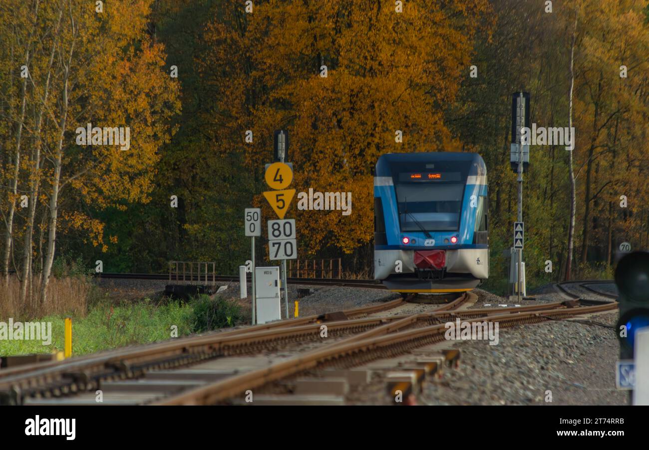 Passenger electric unit train near small station in autumn clean color day in Bludov CZ 11 04 2023 Stock Photo
