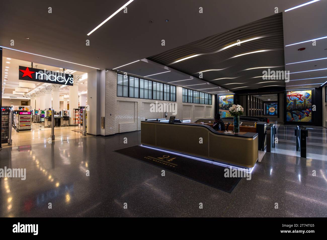 Macy's Department Store shares an entrance with the reception of an office building in Chicago, United States Stock Photo