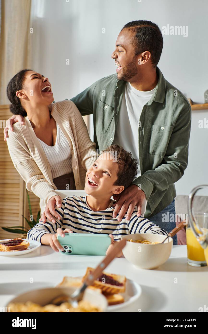 Black family laughing hi-res stock photography and images - Alamy