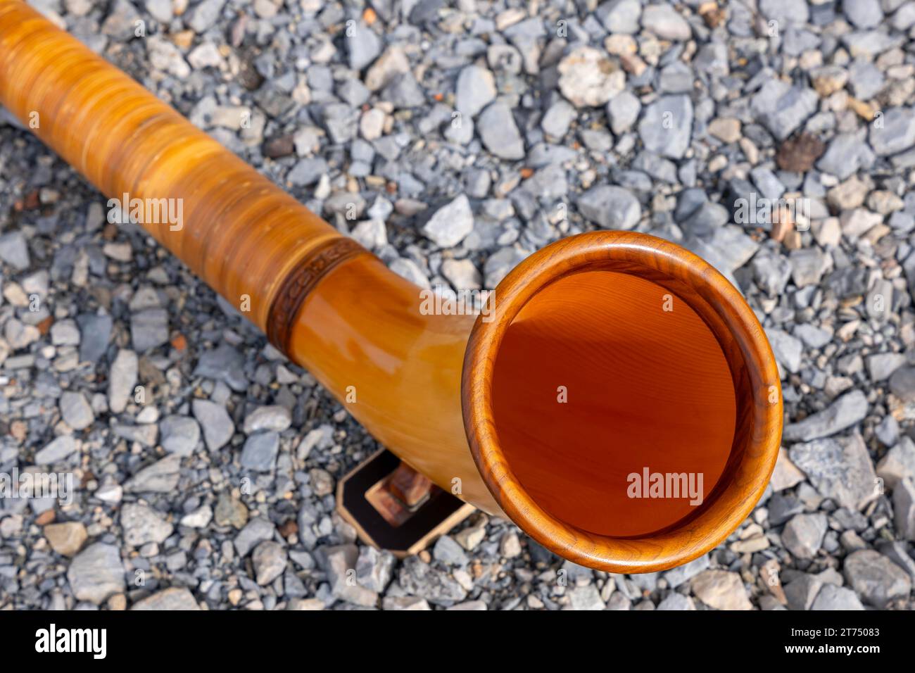 Music Instrument Alphorn Lying on the Ground in a Sunny Day in Switzerland Stock Photo